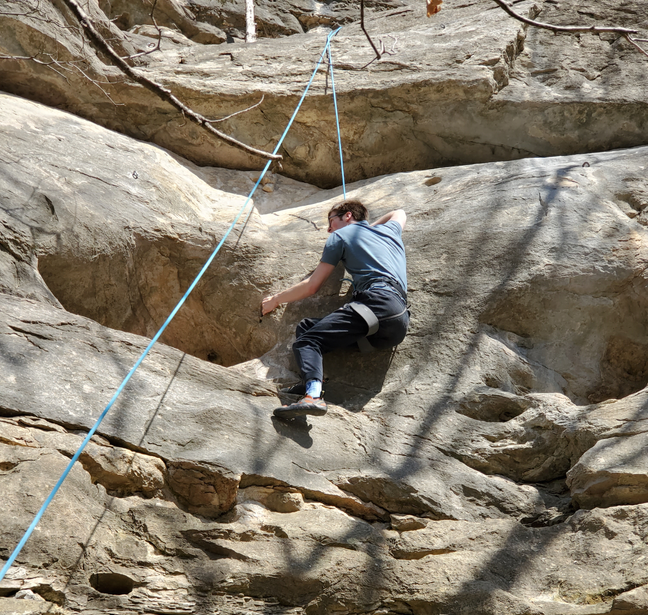 Photo of Joshua Hall (me) rock climbing